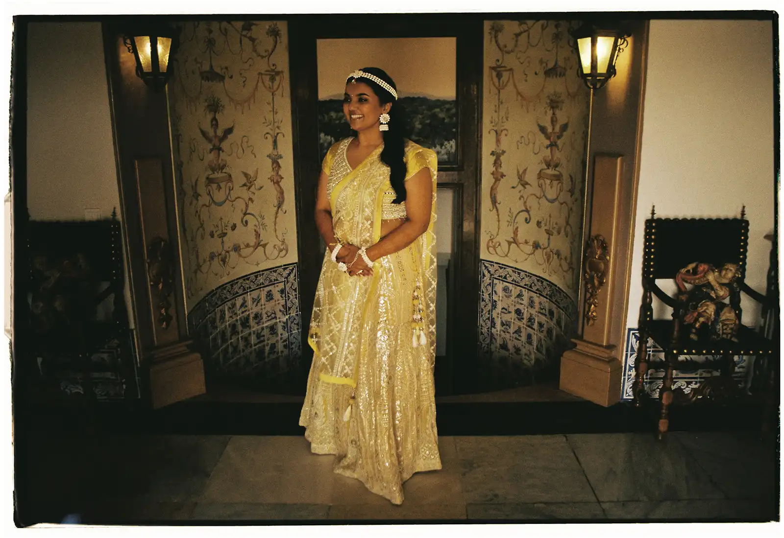 Indian wedding in Portugal. The bride ready for Haldi ceremony in her yellow and gold outfit.