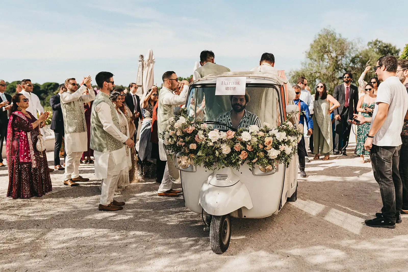 Baarat in a Tuk tuk decorated with flowers. Guest enjoying and dancing during baarat in Portugal.