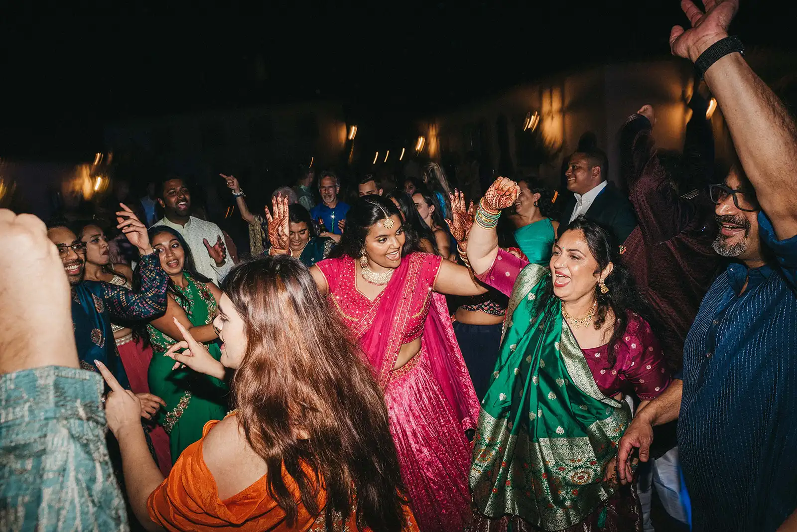 Indian wedding in Portugal, Sangeet party. Guests enjoying the music and partying in the dancefloor.
