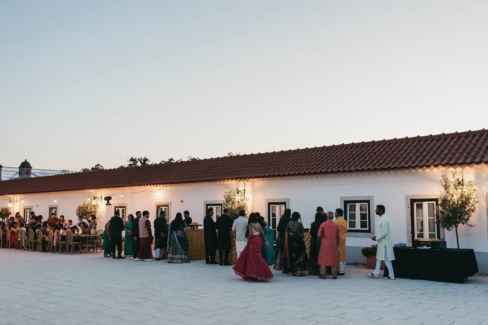 Indian wedding in Portugal in a historic country retreat. Guests in the sangeet dinner.